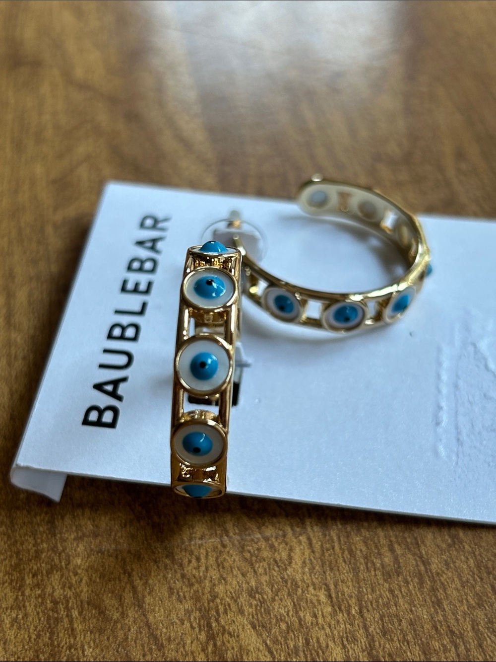 BaubleBar Gold tone Hoop Earrings with Blue and White Evil Eye Accents